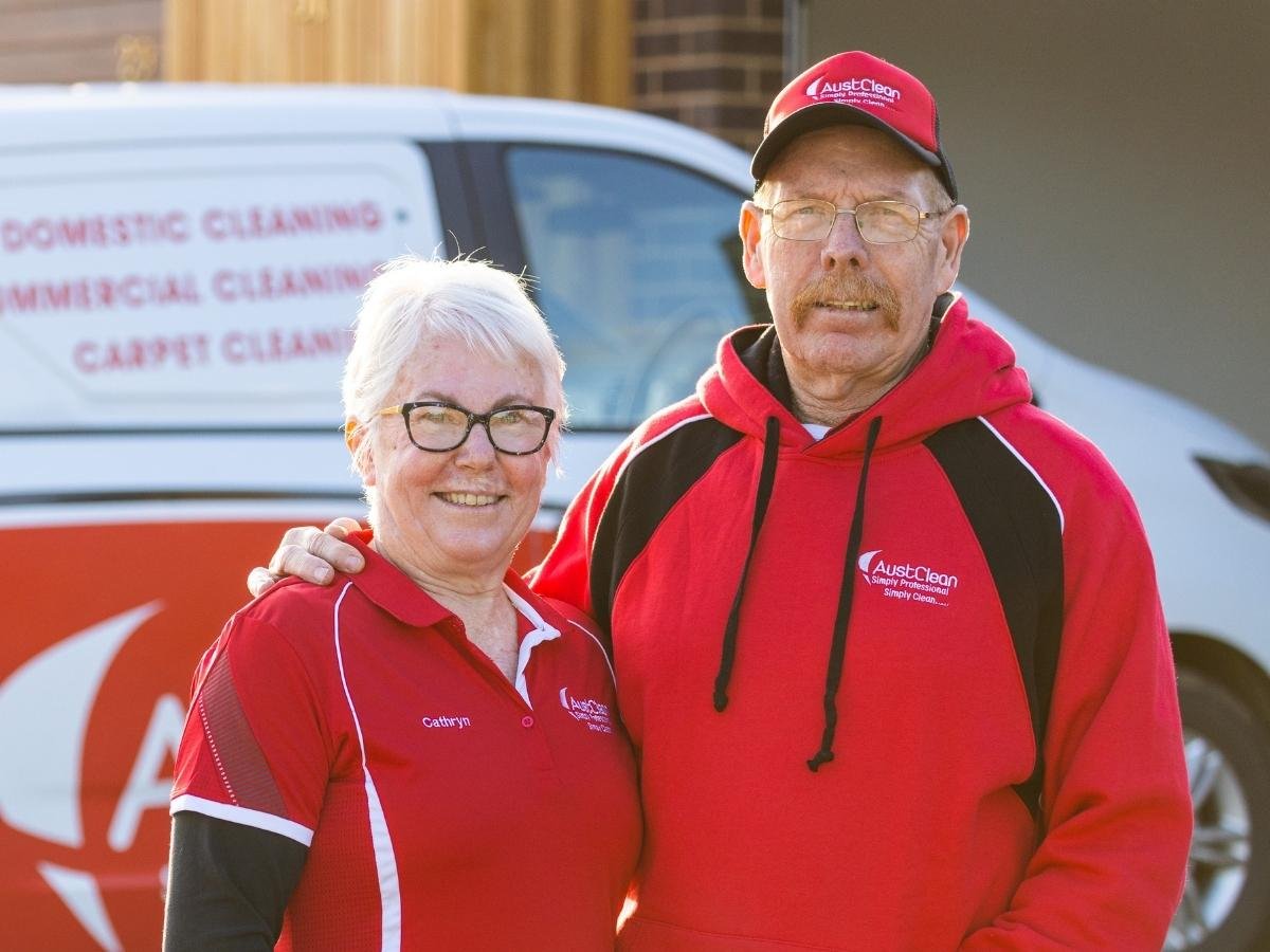 Echuca Cleaning Services 25 Professional AustClean cleaning team - male and female technicians in uniform standing with service van, representing experienced and diverse cleaning professionals across Australia.