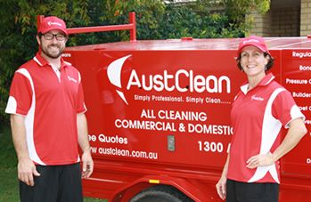 Mooloolaba Interior Cleaning 9 AustClean Mooloolaba cleaning team – two professionals in red uniforms smiling beside a branded trailer, providing trusted interior cleaning and carpet cleaning services in Mooloolaba, Sunshine Coast.