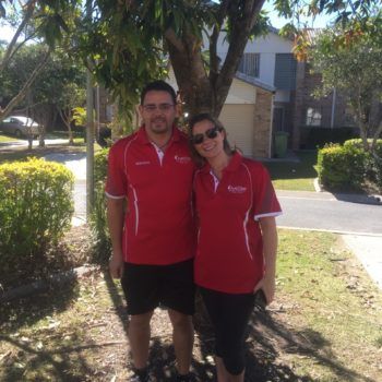 Merrimac Worongary & Surrounds 3 AustClean Tallai team – professional husband and wife cleaning duo in matching red AustClean shirts, representing trusted carpet cleaning and interior cleaning services in the Gold Coast Tallai area.